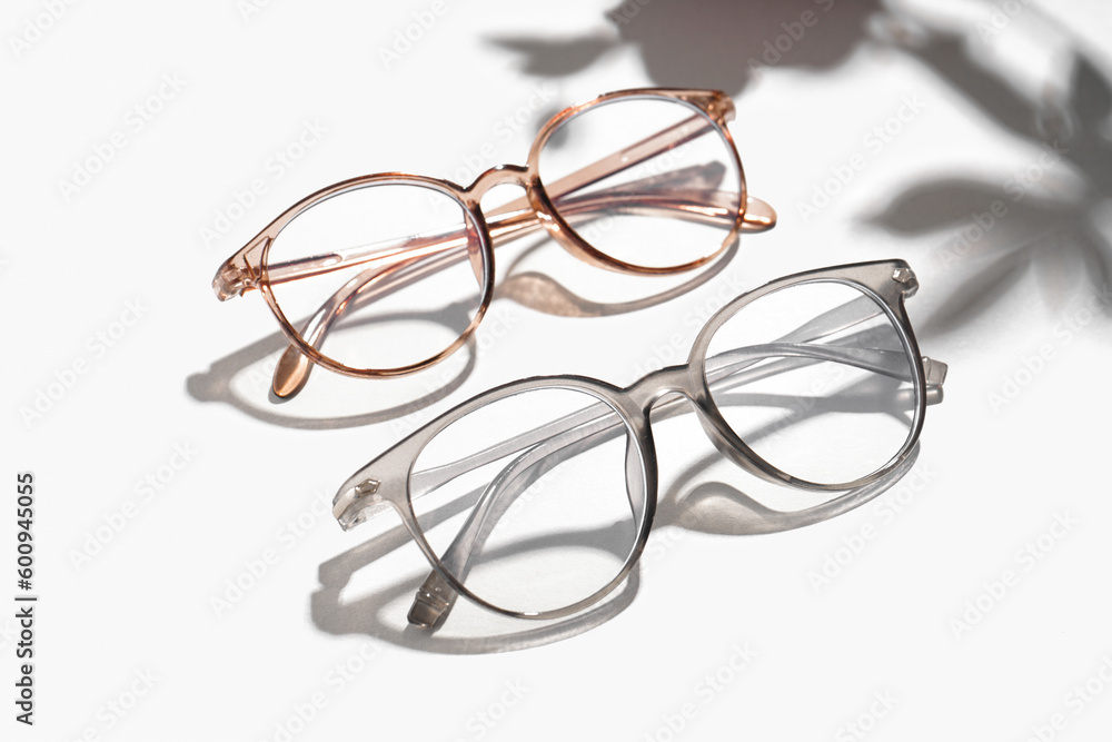 Modern eyeglasses on white background