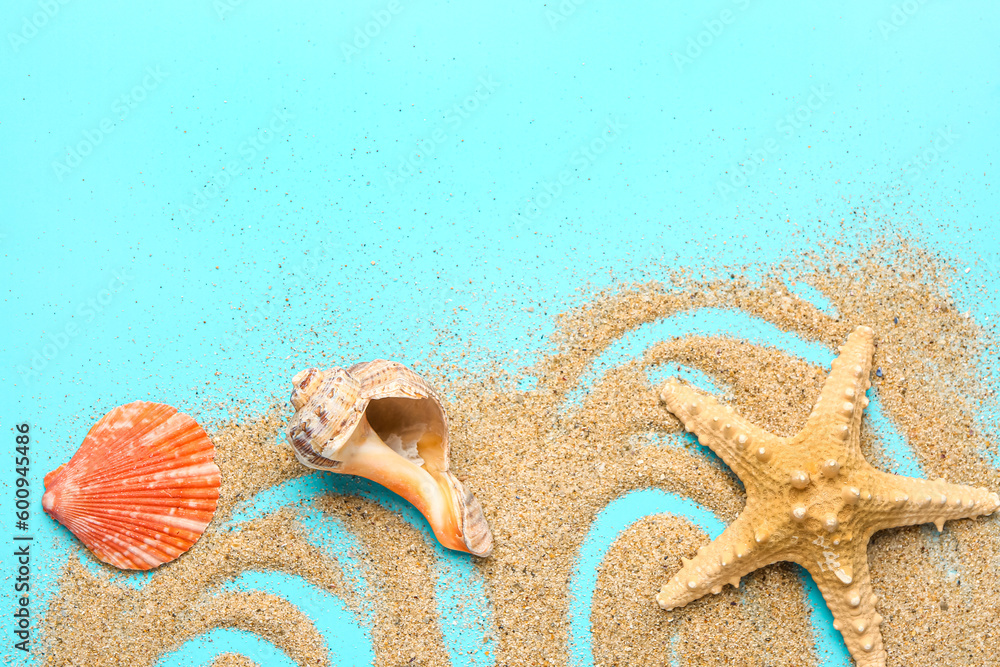 Sand with starfish and shells on blue background