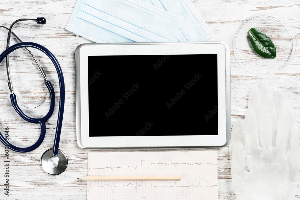 Mock up of doctors desktop with medical supplies