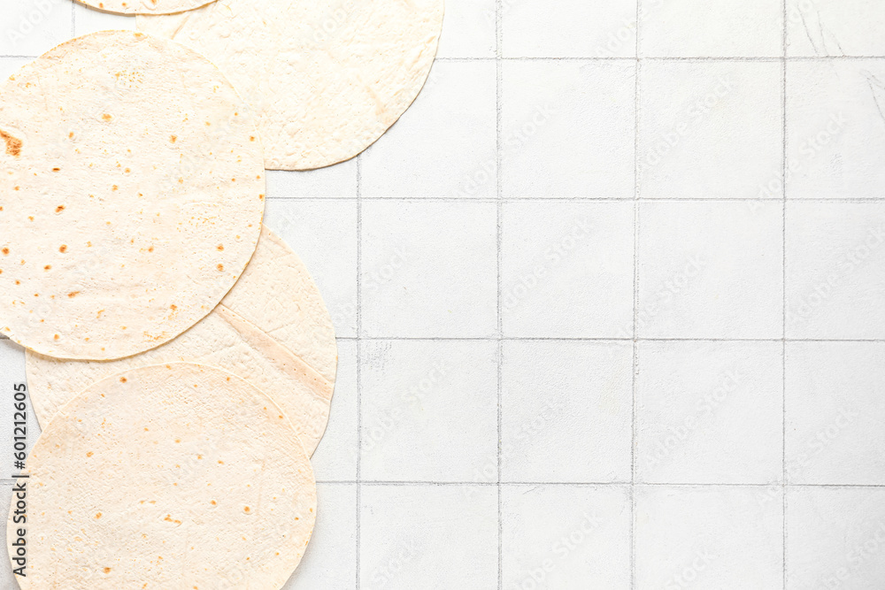 Fresh lavash on white tile background