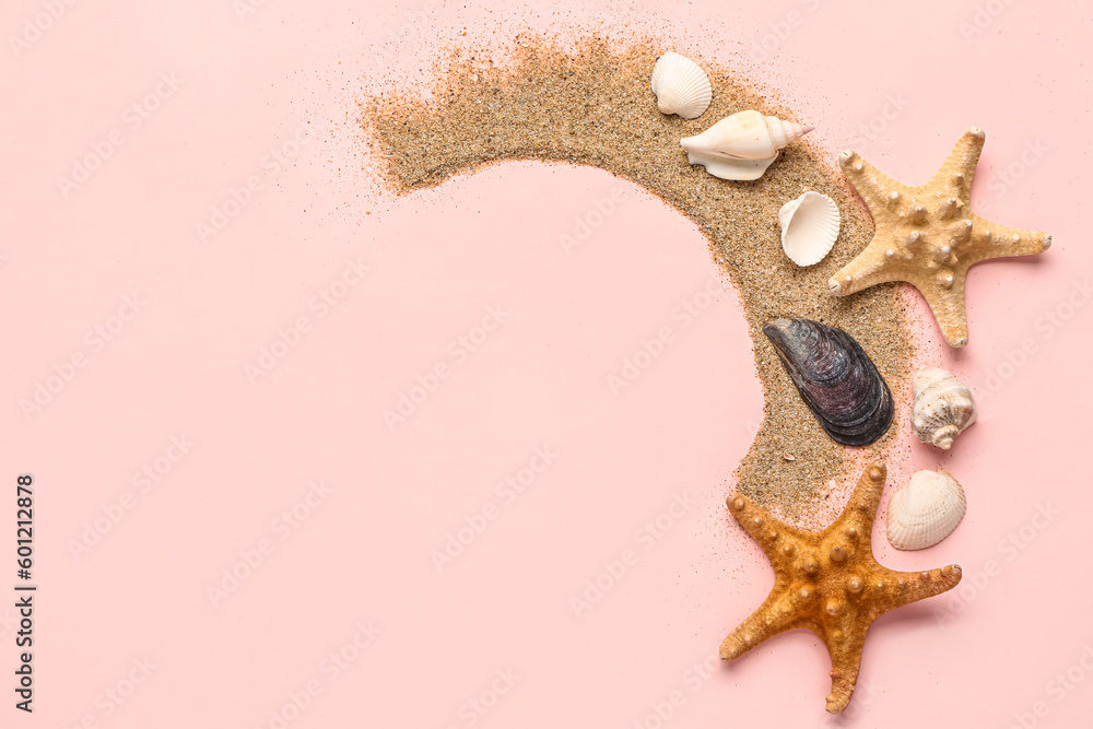 Stroke of sand with seashells and starfishes on pink background