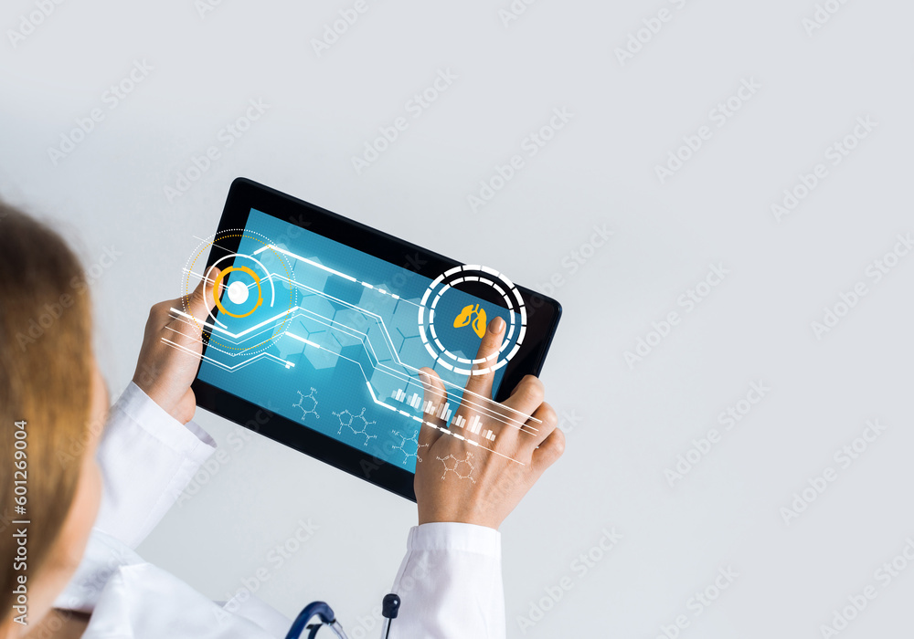 Close of female doctor hands working with tablet pc computer