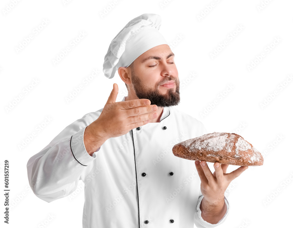 Male baker with fresh bread on white background