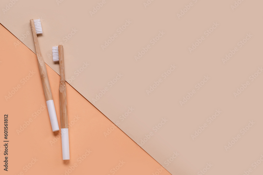 White bamboo toothbrushes on color background