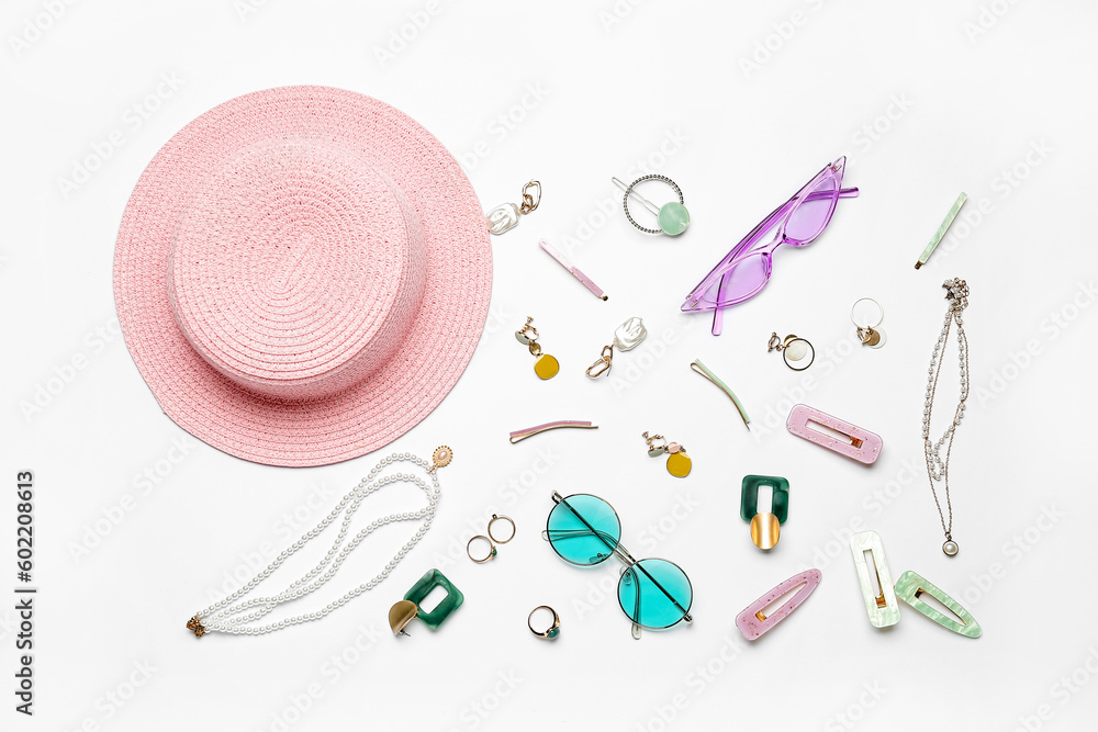 Accessories with sunglasses and summer hat on white background