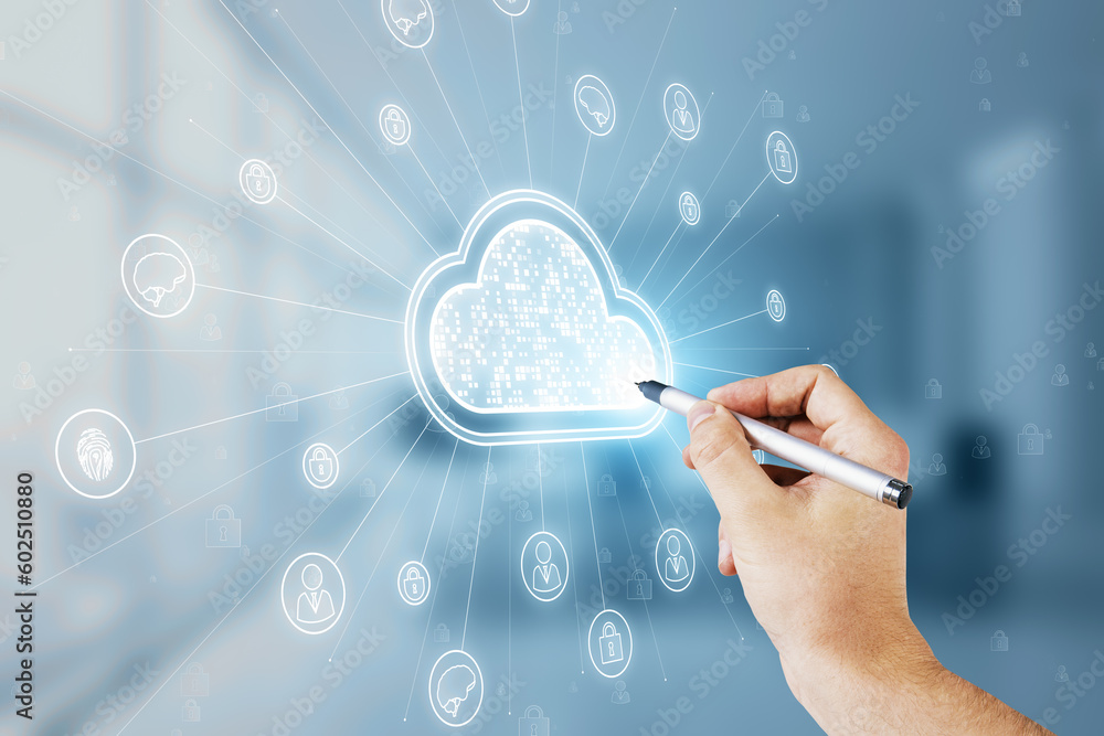 Close up of male hand with pen pointing at digital white cloud hologram with various icons on blurry