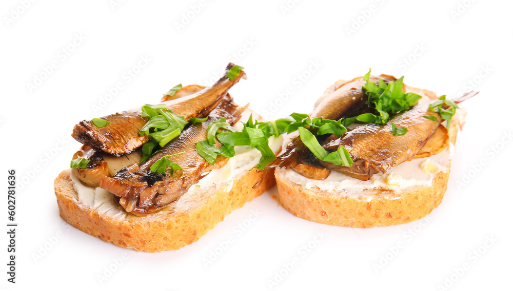 Tasty sandwiches with canned smoked sprats on white background