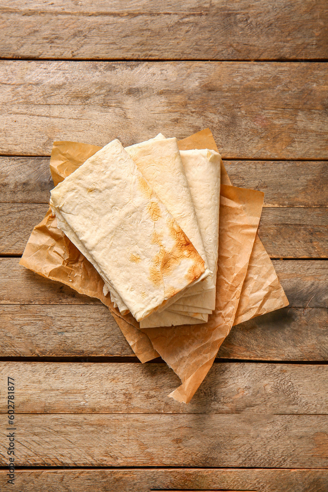 Fresh lavash on wooden background