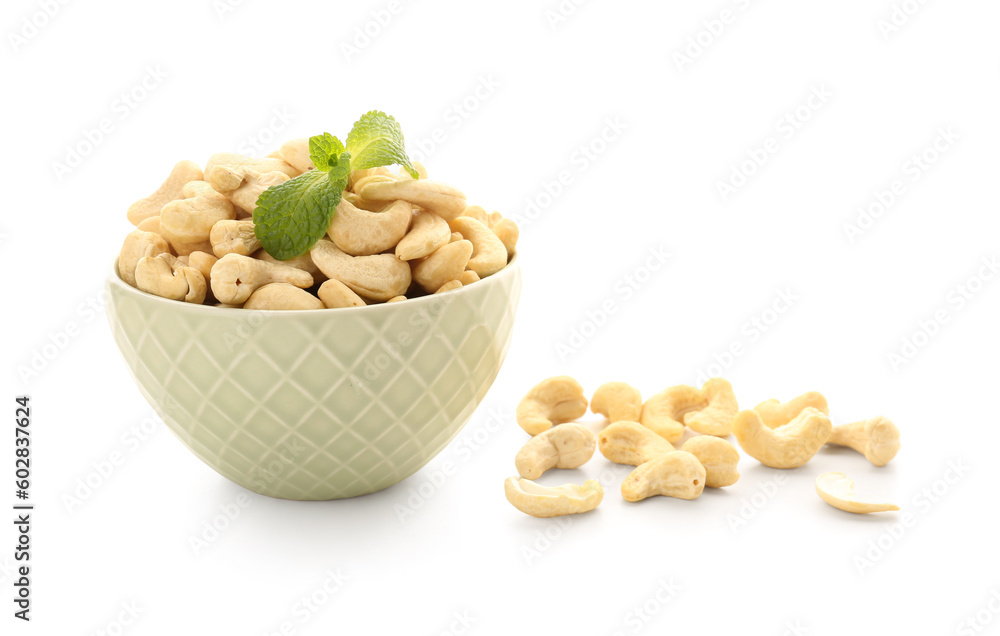 Bowl with tasty cashew nuts isolated on white background