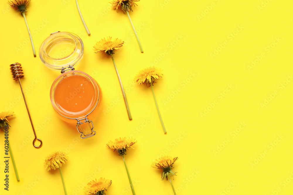 Jar with dandelion honey on yellow background