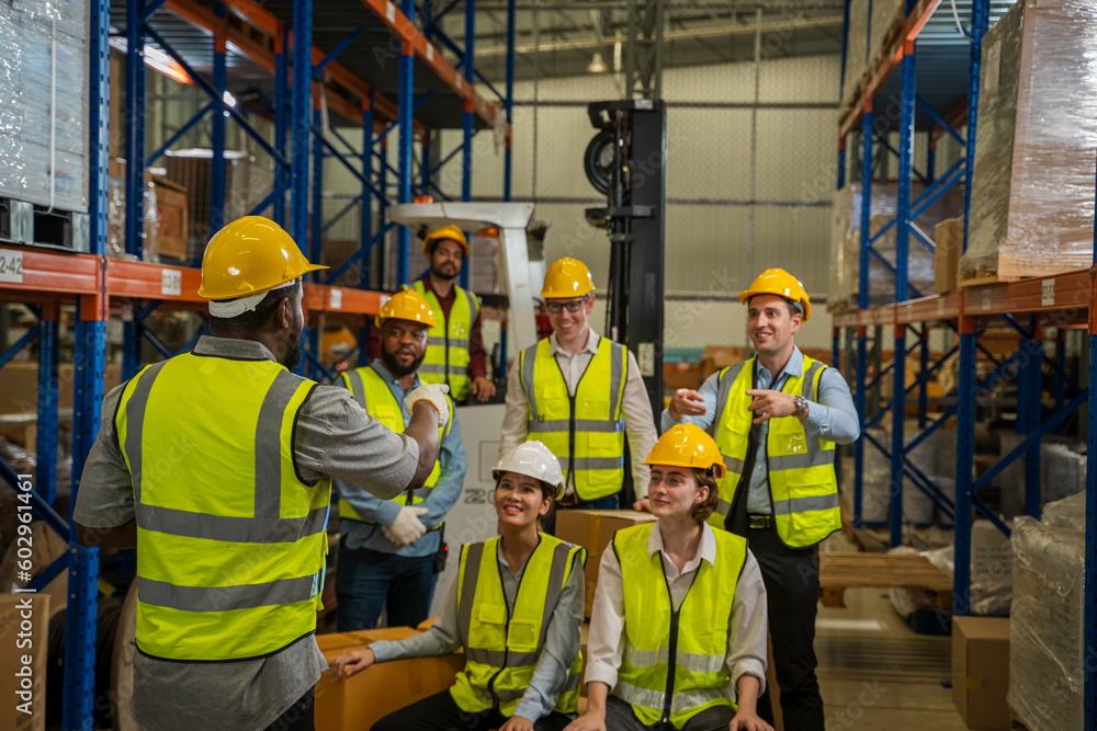 Warehouse workers are meeting together,Group of multicultural logistics employees working as a team 