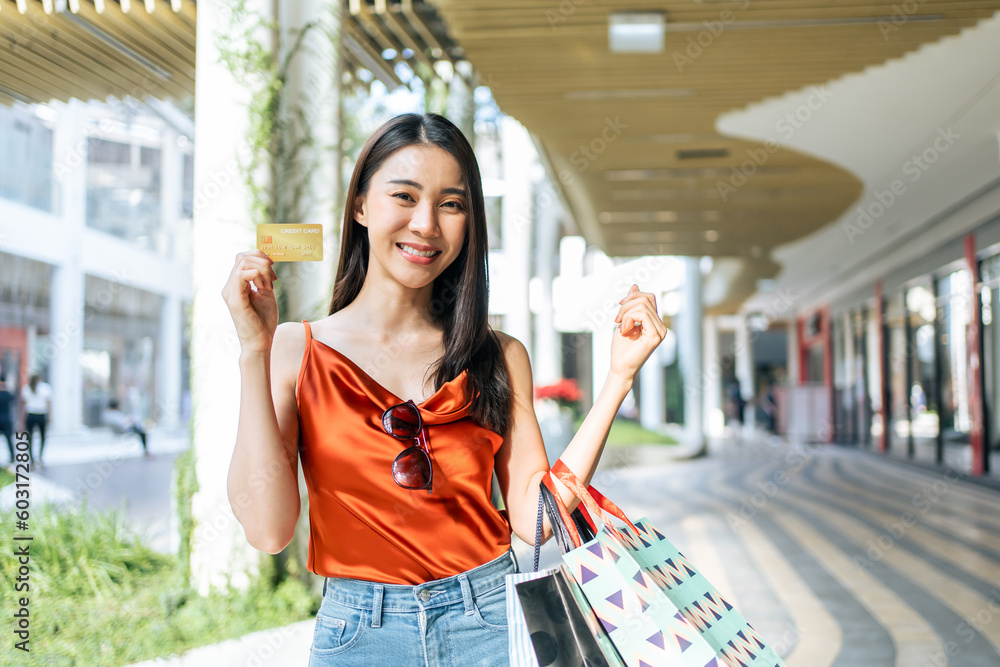 Portrait of Asian attractive girl shopping outdoor in department store.