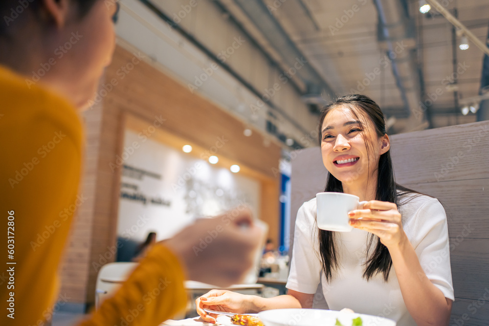 Asian beautiful women having dinner with friend in restaurant together. 