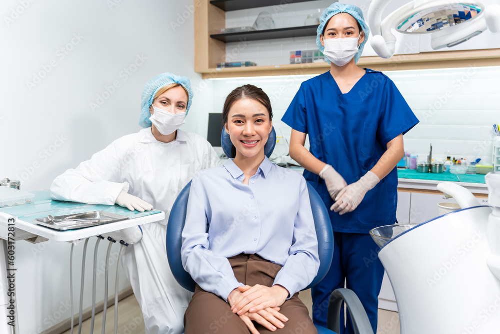 Portrait of Asian young woman patient and dentist at health care clinic.