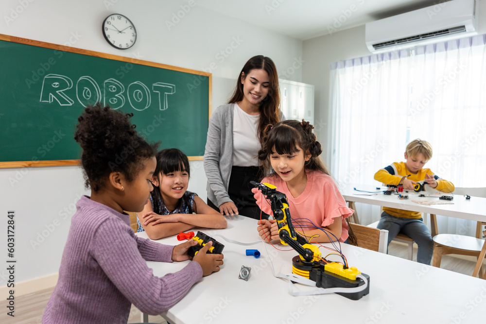 Caucasian woman teacher teaching a lesson to kids at elementary school.