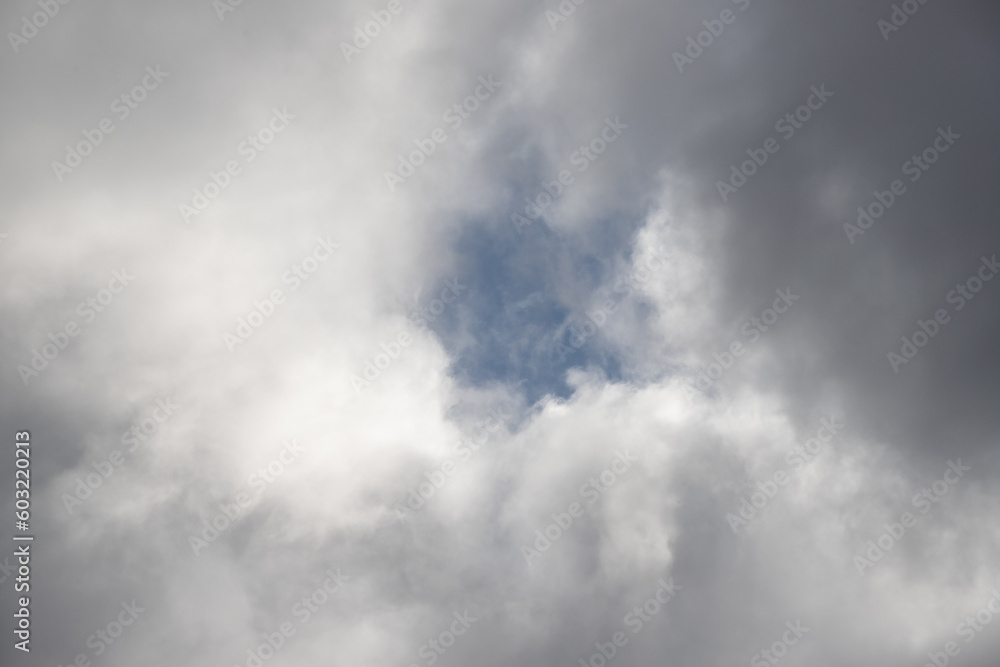 White clouds against the blue sky. Cloudy sky background.