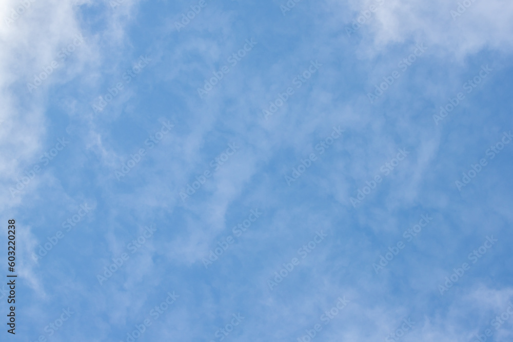 White clouds against the blue sky. Cloudy sky background.