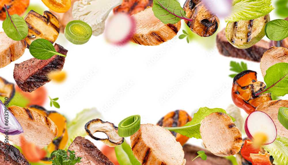 Warm salad, grilled meet slices and chopped barbecue vegetables with herbs and salad leaves isolated