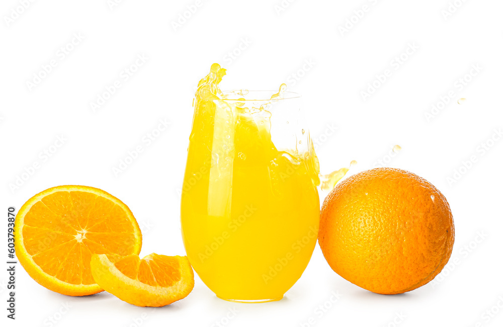 Glass of fresh orange juice with splashes on white background