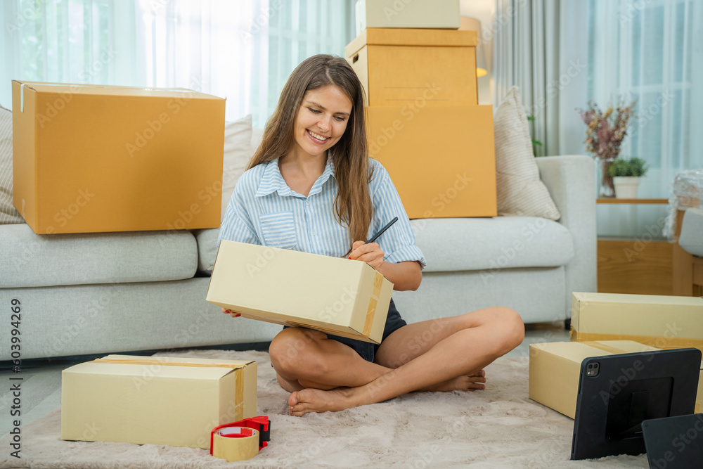 Owners female entrepreneurs check online orders to prepare to pack the boxes,Sell to customers,Start