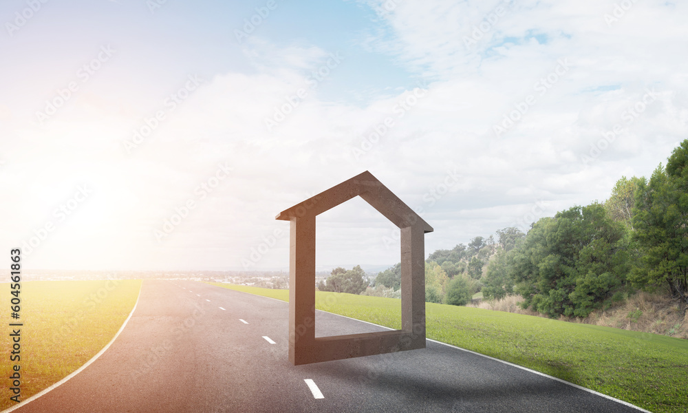 Conceptual background image of concrete home sign on asphalt road