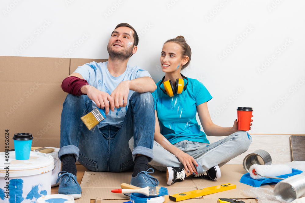 Happy smiling couple relaxing on floor