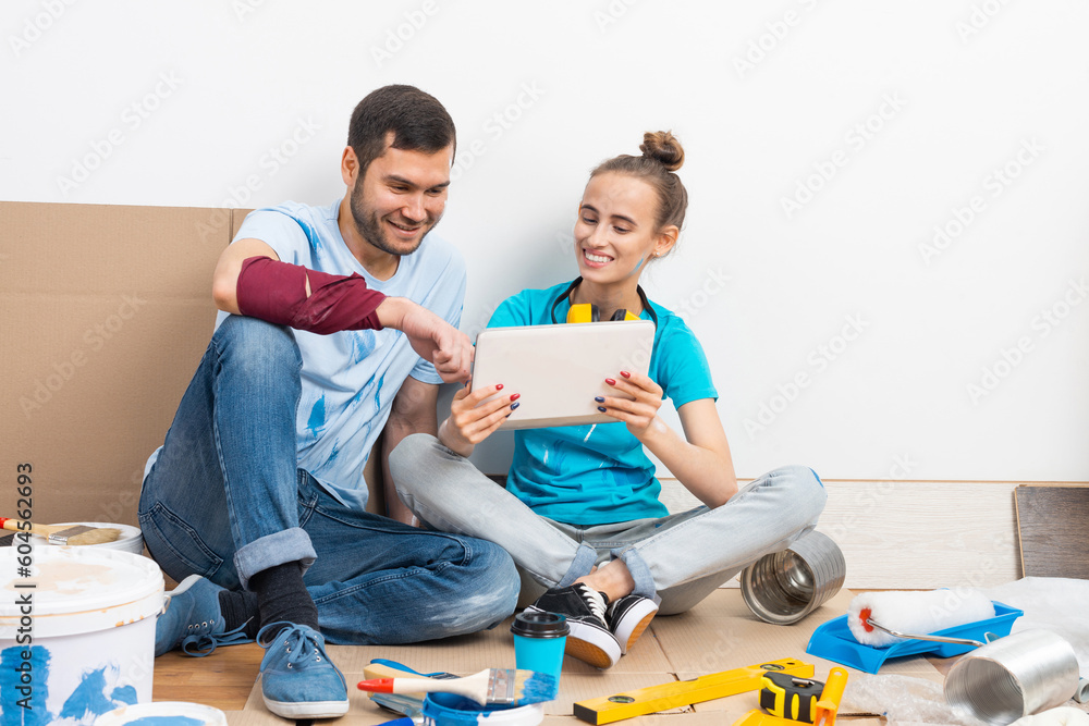 Couple watching something funny on tablet computer