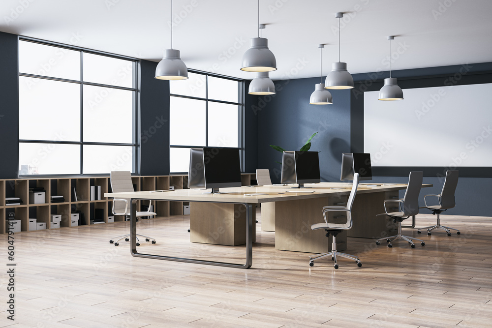 Clean meeting room interior with wooden flooring, concrete wall, white screen and window with city v