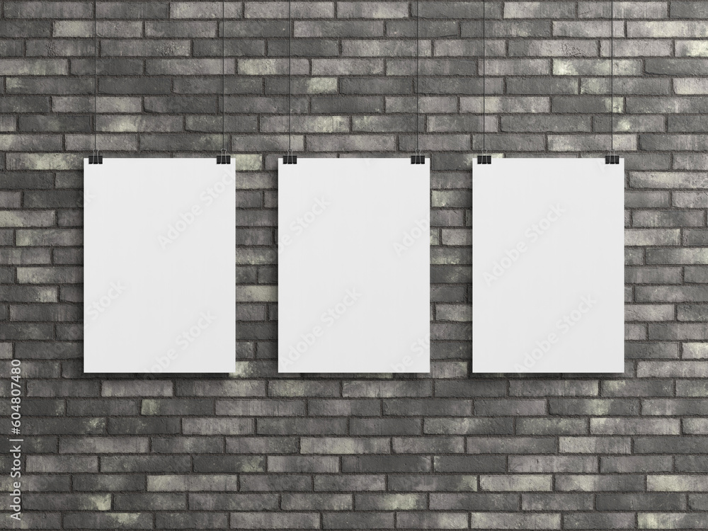 Three Blank vertical poster hanging with clips on a wall Mockup. 3D rendrering