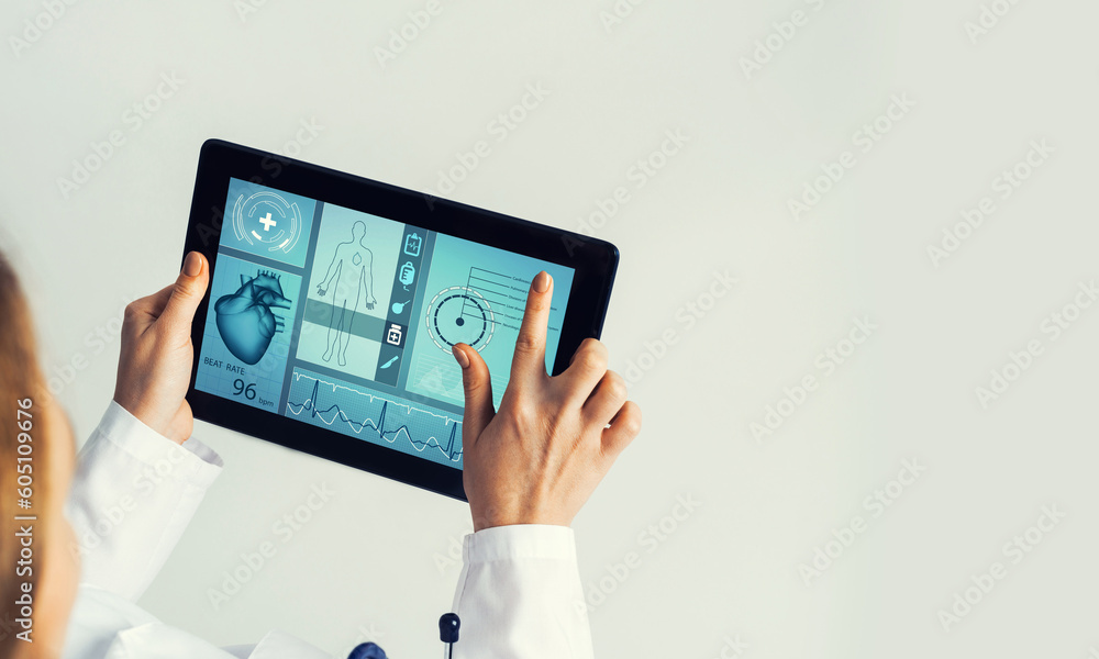 Close of female doctor hands working with tablet pc computer