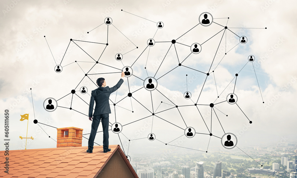 Businessman on house roof presenting networking and connection c