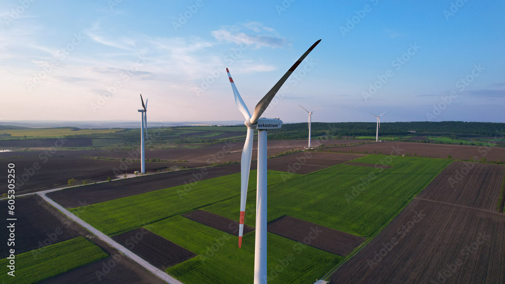 Windmill turbines generating green energy electric.Green energy helps reduce carbon emissions and ma