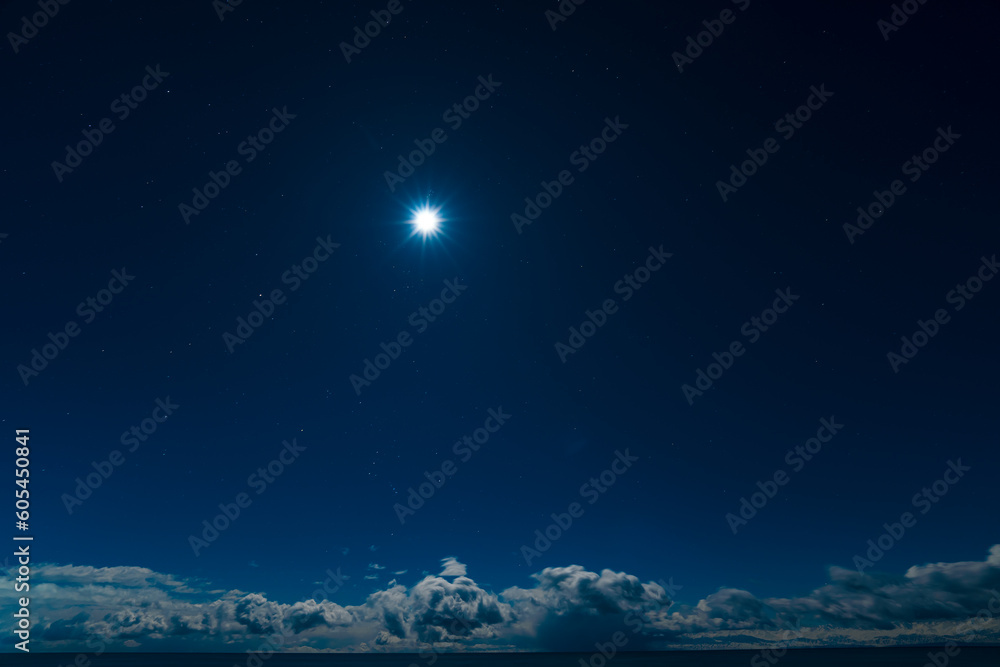 Moon shine on night sky with clouds