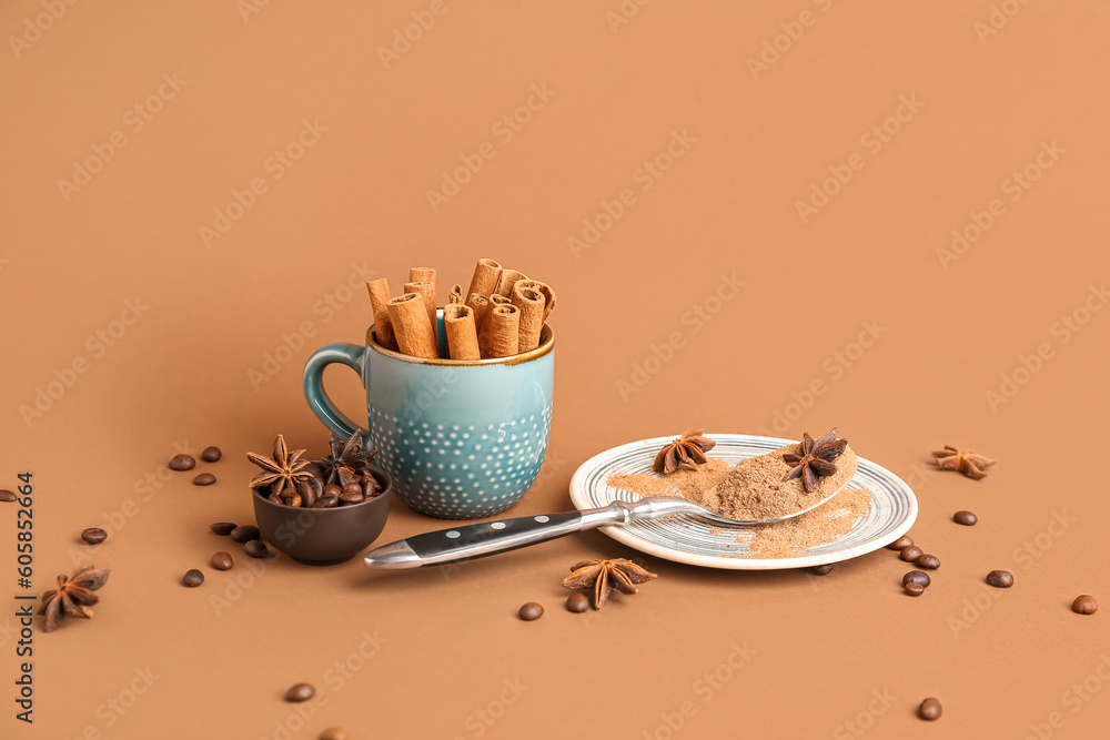 Plate with cinnamon powder, sticks, anise stars and coffee beans on color background