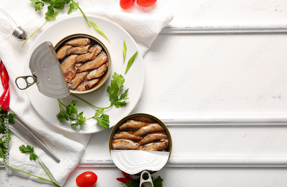 Plate of canned smoked sprats with parsley on white wooden  background