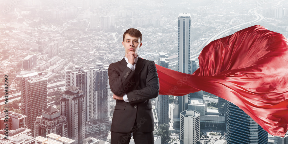 Concept of power and sucess with businessman superhero in big city