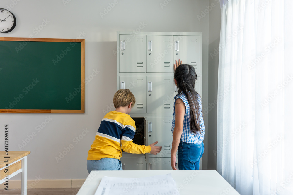 Young student leave classroom after finished study in elementary school. 