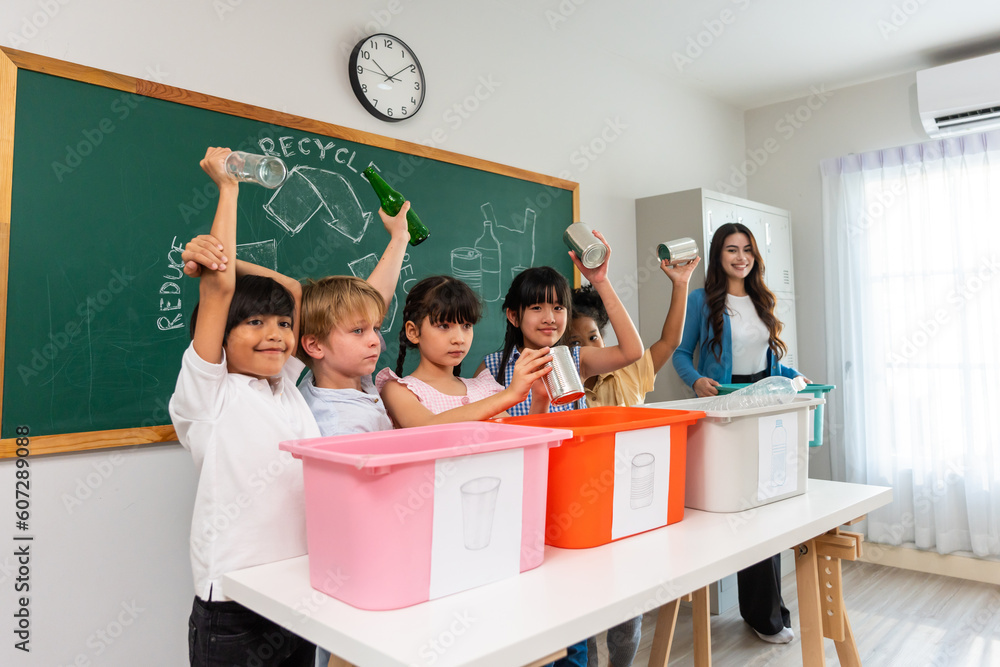 Group of student learn with teacher in classroom at elementary school. 