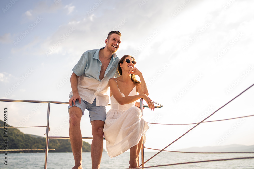 Caucasian romantic couple looking at beautiful view during yachting. 