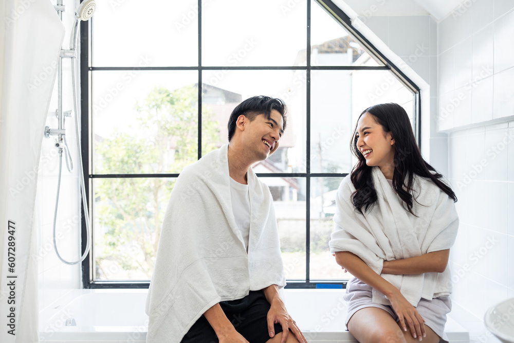 Asian new marriage couple spending time together in bathroom at home. 