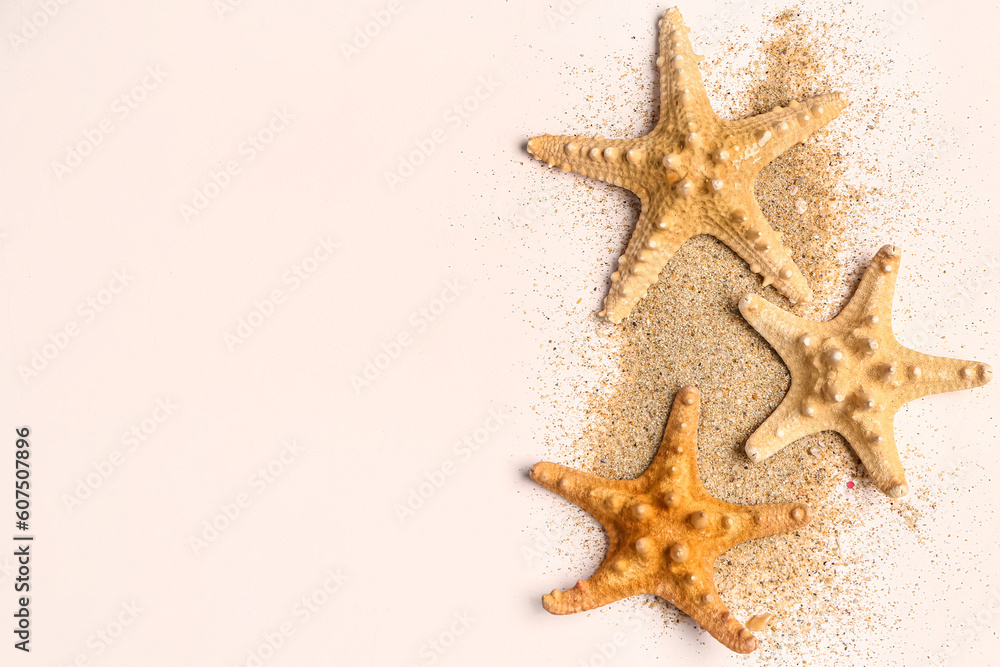 Starfishes with sand on white background