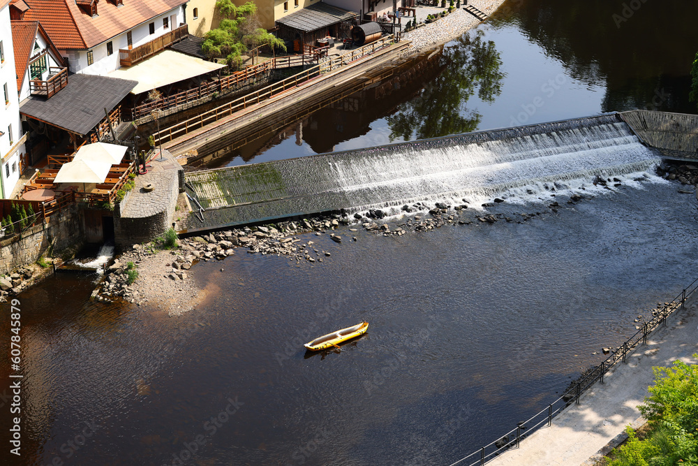 Yellow kayak floating on the river.