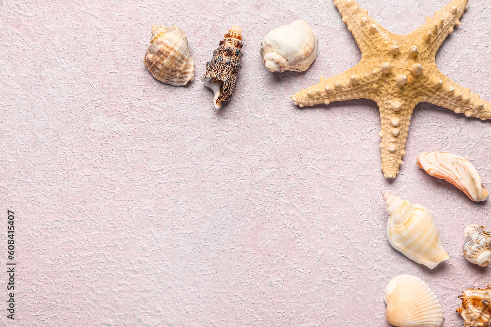 Seashells and starfish on lilac background