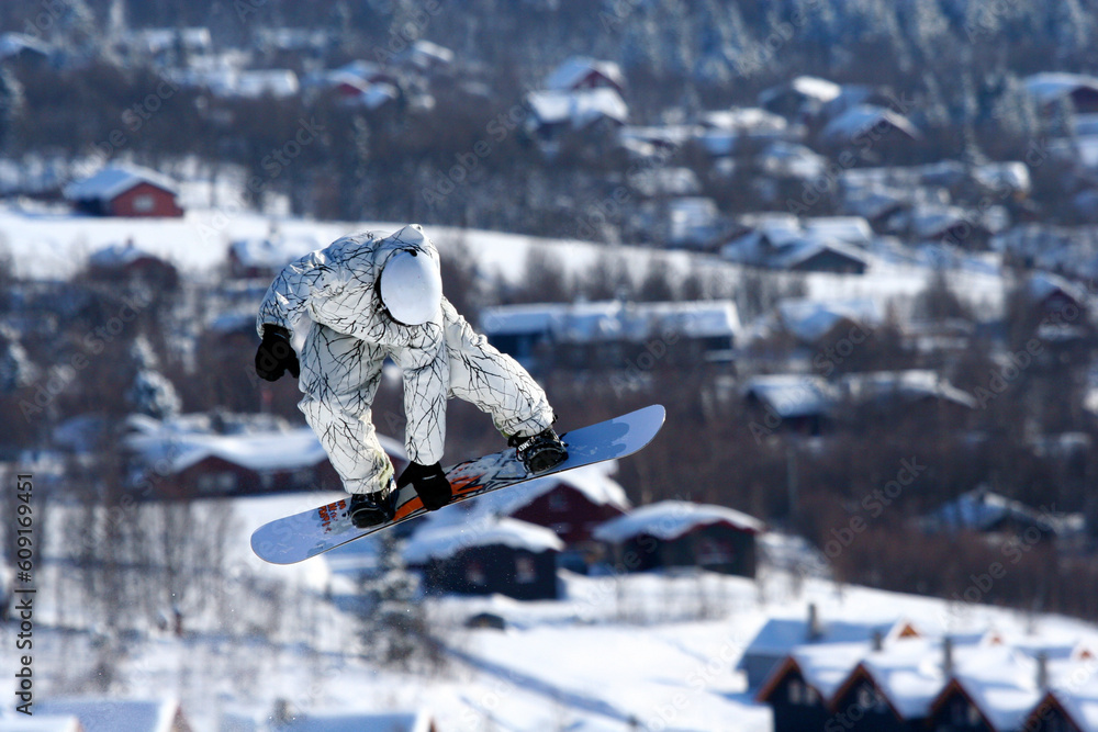 A snowboarder mid-air.