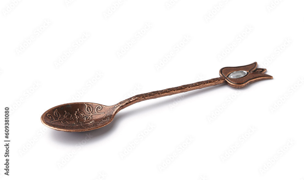 Decorated vintage spoon with gem isolated on white background