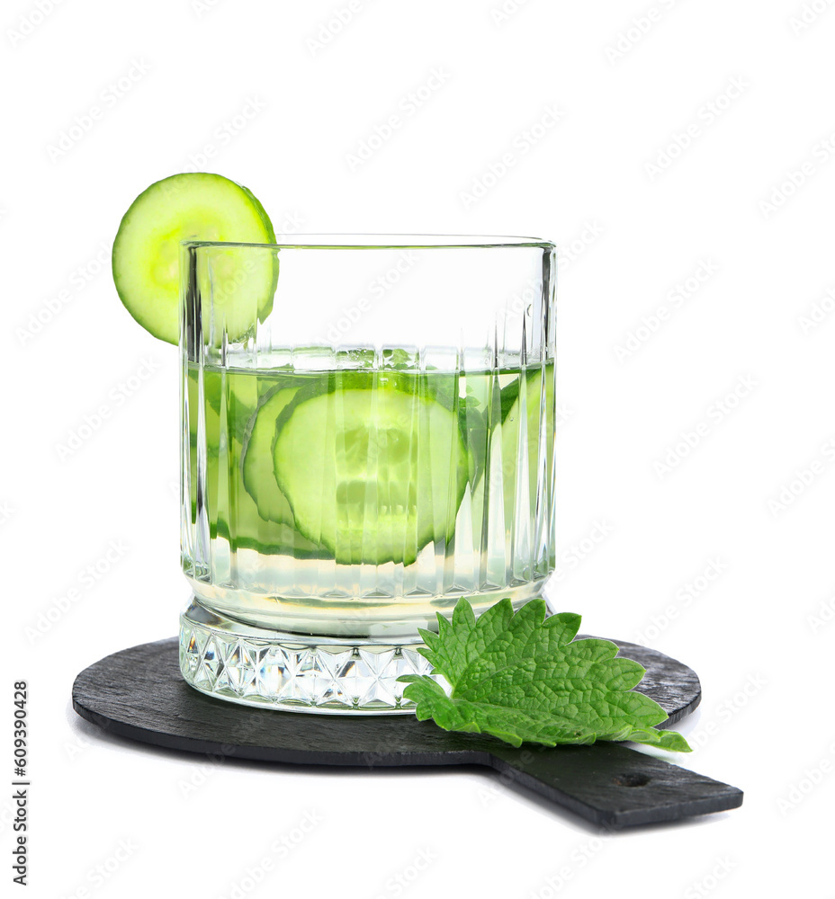 Board and glass of infused water with cucumber slices on white background