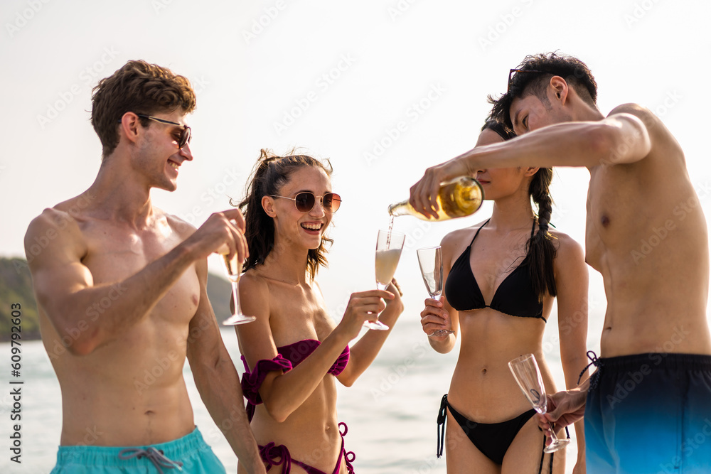 Group of diverse friends drink champagne while having a party in yacht. 