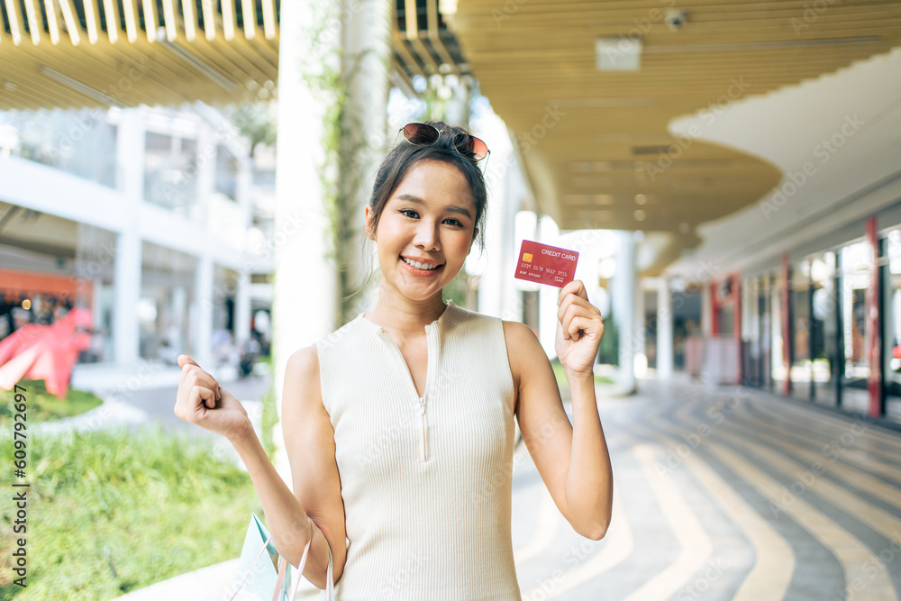 Portrait of Asian attractive girl shopping outdoor in department store. 