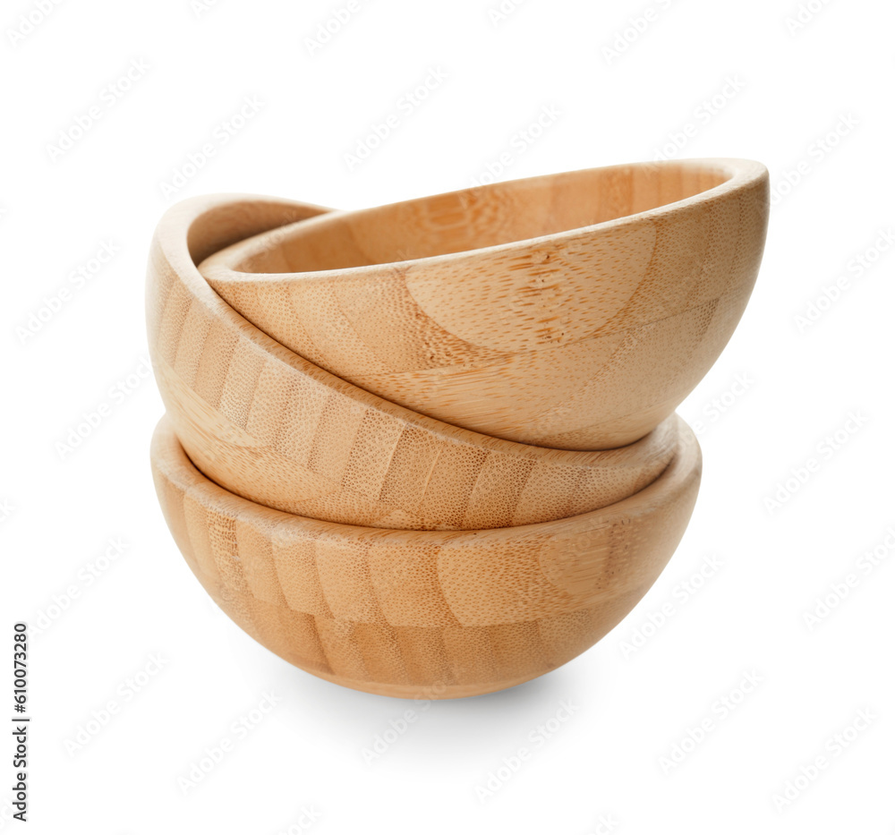 Stack of wooden bowls on white background