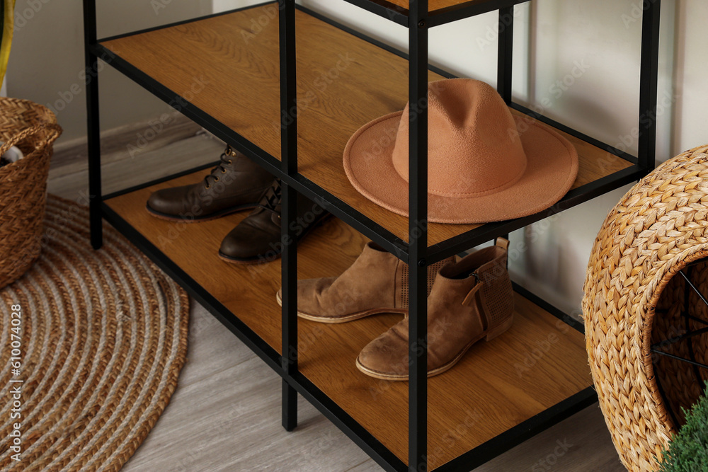 Shelving unit with hat and shoes in living room